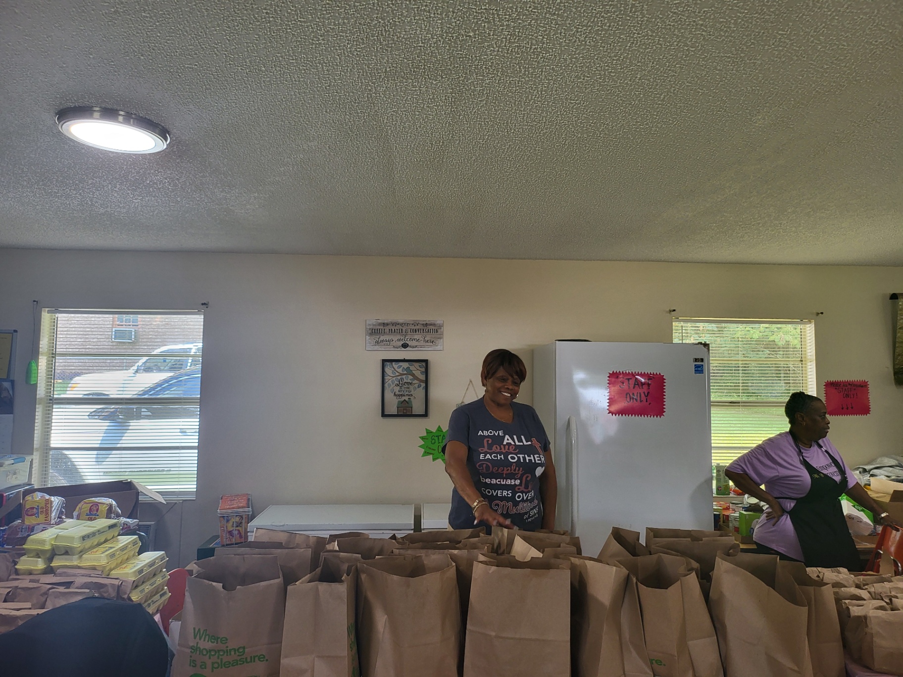 Volunteers preparing food bags for distribution