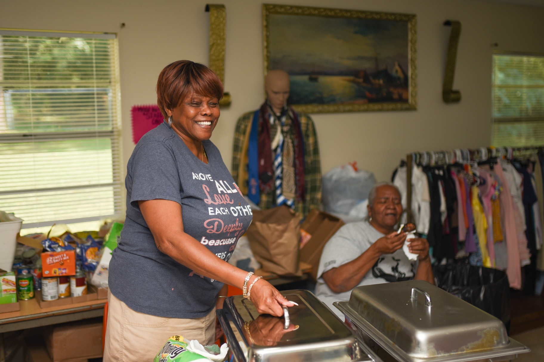 Volunteer welcoming guests at the center